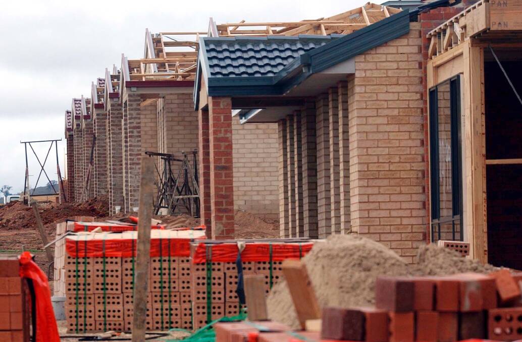 Housing construction in Gungahln in 2003. The ACT government will accept pitches for demonstration housing precincts to try out new models of housing that aren't allowed in the territory plan.  Photo: Alan Porritt