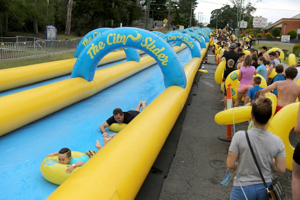 Hundreds of people enjoy the City Slider - a 325m Street Water Slide - in Brisbane Photo: Michelle Smith