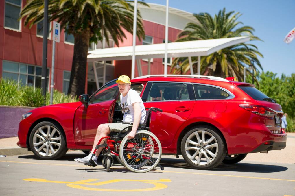 Alistair Nitz is concerned about what he believes is a lack of disability parking at CISAC in Belconnen. Photo: Jay Cronan