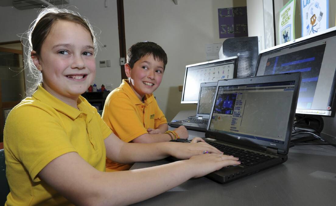 Richardson Primary School year 5 students Illiana Fogerty, 11, and Cody Selig, 10, using the school's computers. Photo: Graham Tidy