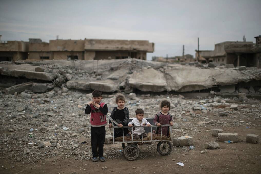 Children in the west of Mosul, Iraq, last month. Photo: AP