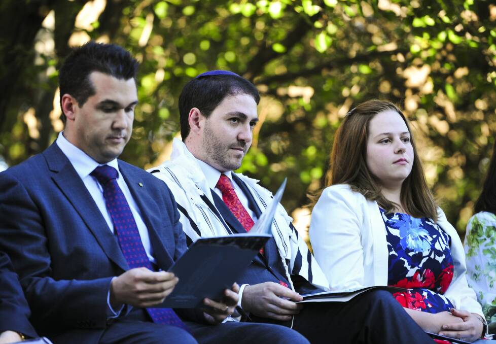 Celebration: MP Michael Sukkar and Rabbi Alon Meltzer and his wife, Linsay, at the inauguration in Canberra. Photo: Melissa Adams