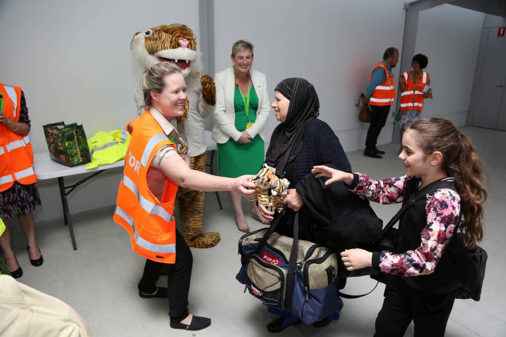 Some of the first passengers on Tigerair's revived Melbourne flights arrive at Canberra airport.  Photo: Paul Sadler