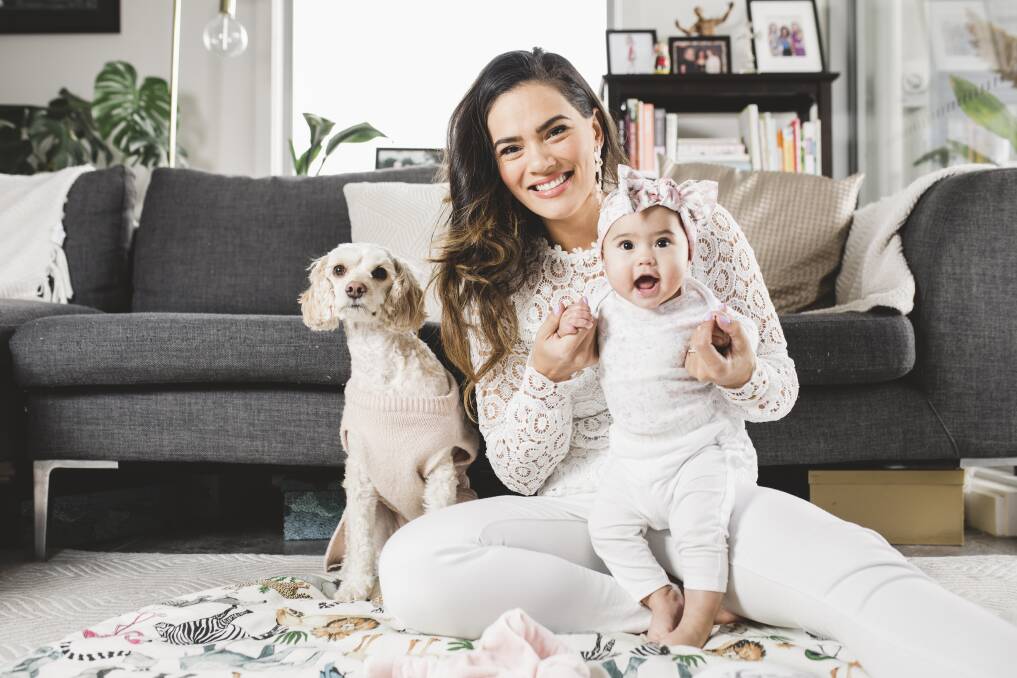 Janette Wojtaszak, with baby Luna and puppy Cookie, is the face of the SurfaceGo's national campaign. Photo: Jamila Toderas
