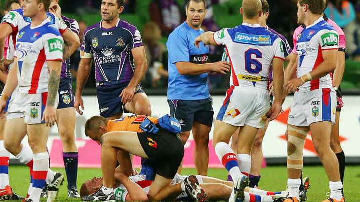 Alex McKinnon lays on the ground after being tackled. Photo: Michael Dodge