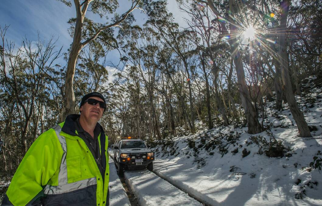Transport Canberra and City Services Project Officer Adam Melville looks after icy or snow affected roads in the Namadgi National Park area (near the Mount Franklin chalet site) Photo: karleen minney