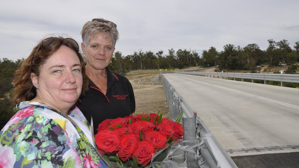 Melissa Pearce and her sister-in-law Sue Ellen Hughes pay tribute to James Hughes, who died in an October motorcycle accident on the approach to Oallen Ford Bridge. Photo: Louise Thrower