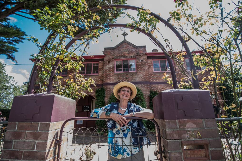 The owner of the former Saint Joseph's Convent in Bungendore, Pamela Orr, stands at its gates. Photo: Karleen Minney
