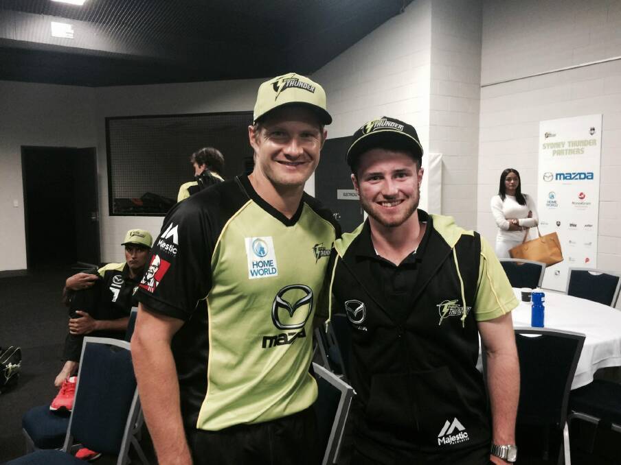 Surreal experience: Cricket ACT junior Mac Wright meets Sydney Thunder star Shane Watson. Photo: Supplied