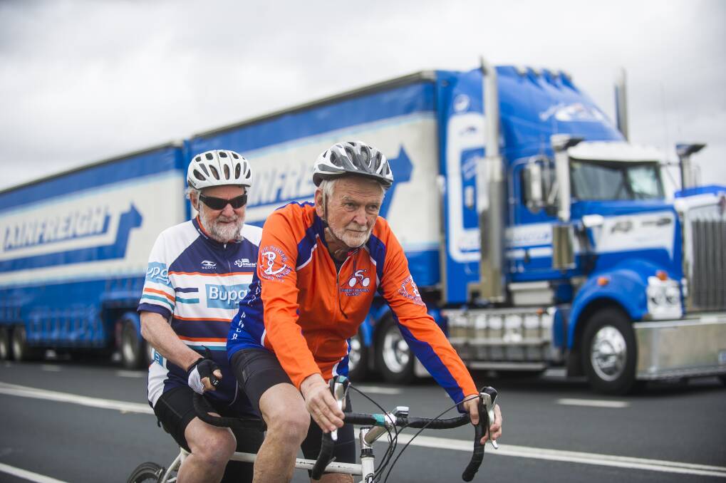 Fitability tandem cyclists Peter Granleese and Glenn Cocking on the Barton Highway. Photo: Dion Georgopoulos