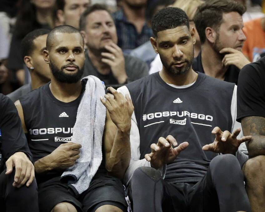 In harmony: San Antonio Spurs won five championships during Tim Duncan's career, including teaming up with Patty Mills for the 2013-14 title. Photo: AP