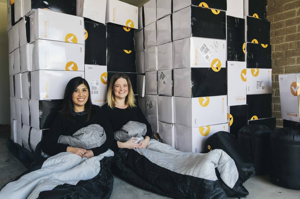Canberrans Soudalay Thammavongsa and Emma Madsen with more than 100 sleeping bags they will donate to homeless Canberrans. Photo: Rohan Thomson