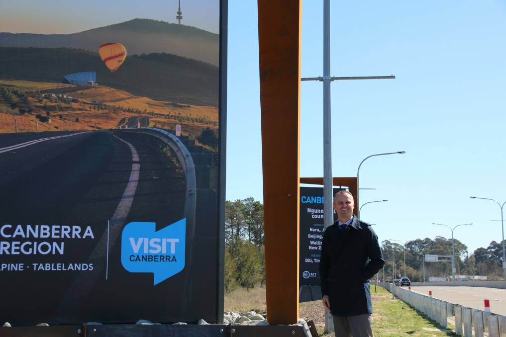 ACT Chief Minister Andrew Barr with one of the new Welcome to Canberra signs. Photo: Supplied