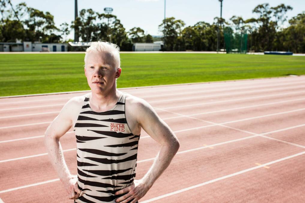 Sprinter Chad Perris says albinism has not stopped him from training outside in the scorching summer heat. Photo: Jamila Toderas