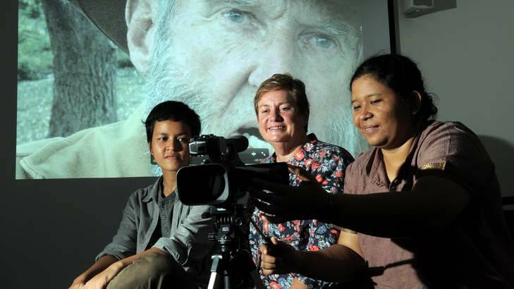 Indonesian film makers, Chairun Nissa, left and Dwi Sujanti Nugraheni, right, with Sara Darling, centre, at the ANU Digital Humanities Hub. Photo: Graham Tidy
