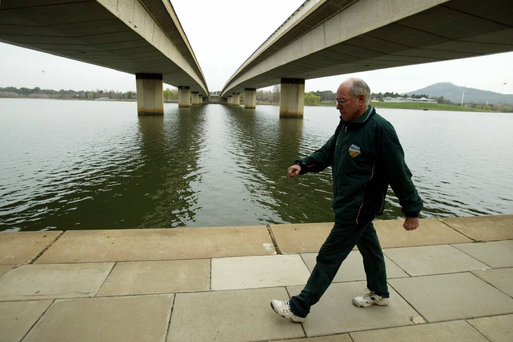 Then prime minister John Howard going for his walk this morning around Lake Burley Griffin in Canberra in 2004. Photo: Pat Scala