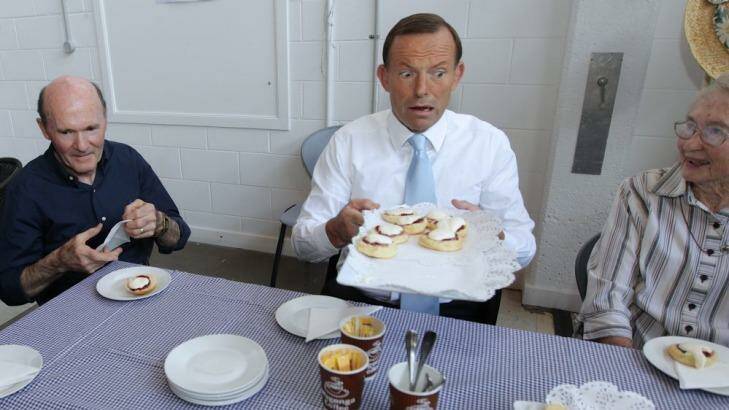 Tony Abbott having morning tea at the ACT Carers ACT Headquarters in Canberra in 2012. Photo: Alex Ellinghausen