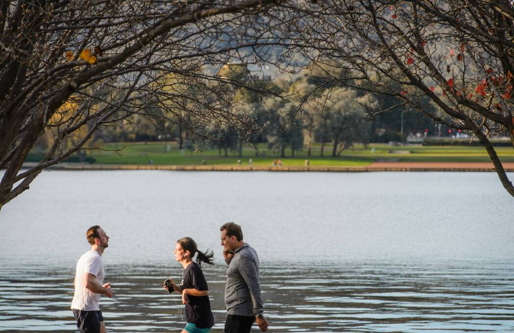 Residents soak up the picturesque surroundings of Lake Burley Griffin earlier this week. Photo: Sitthixay Ditthavong