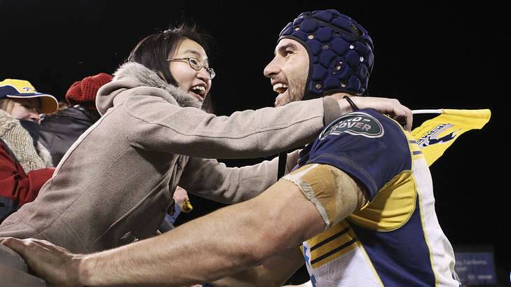 Scott Fardy of the Brumbies is congratulated by a fan after they beat the British & Irish Lions. Photo: Getty
