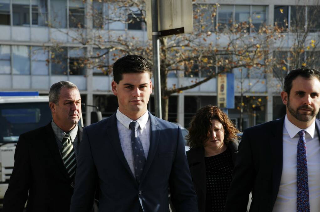 ADFA cadet Jack Toby Mitchell, second from left, arrives at the ACT Supreme Court with his parents last week. Photo: Alexandra Back