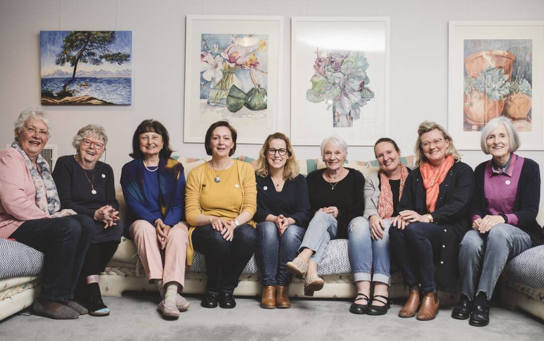 Canberra's Art in Miniature artists (from left) Jocelyne Godber, Jan Vincent, Eva Henry, Camelia Smith, Kylie Fogarty, Sandra House, Cheryl Hodges, Michaela Laurie and Lyn Cottingham. Photo: Jamila Toderas