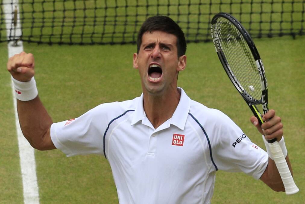 Done it: Novak Djokovic celebrates winning the Wimbledon title against Roger Federer. Photo: Jonathan Brady