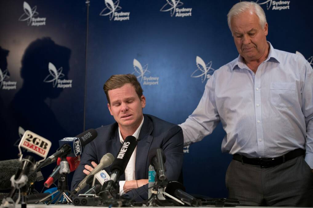 Former Australian Cricket Captain, Steve Smith with his father, Peter Smith, addresses the media at Sydney Airport, after arriving back from the cheating scandal in South Africa. Photo: Janie Barrett