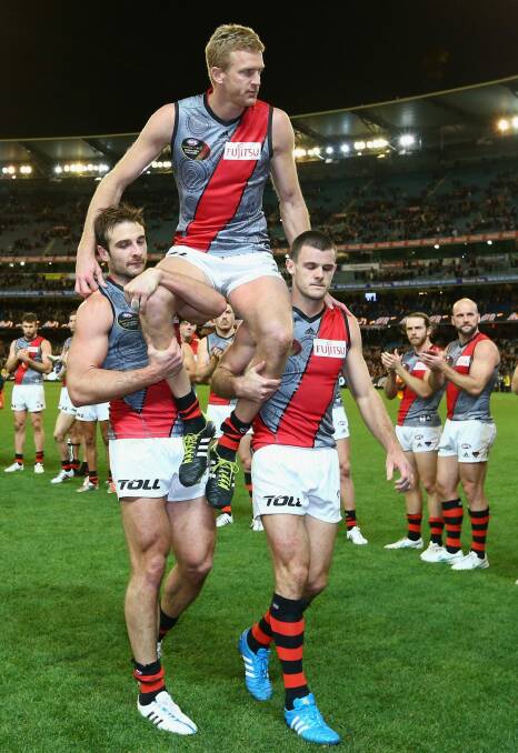 Dustin Fletcher is chaired off after what proved to be his final game. Photo: Getty Images