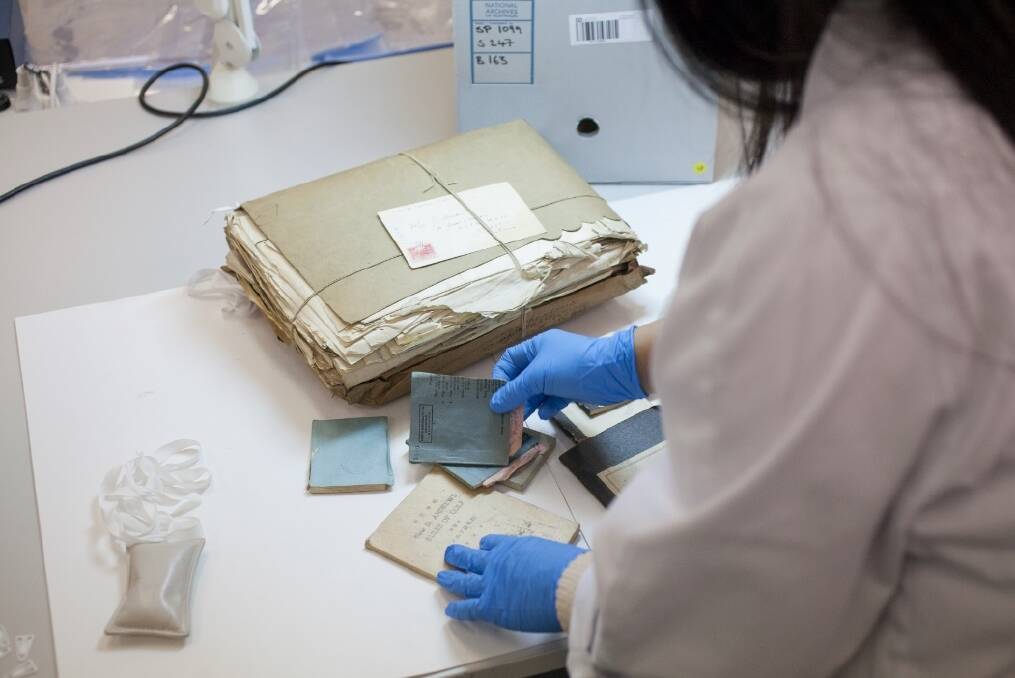 Conservation of the records being gifted by the National Archives.  Photo: Supplied