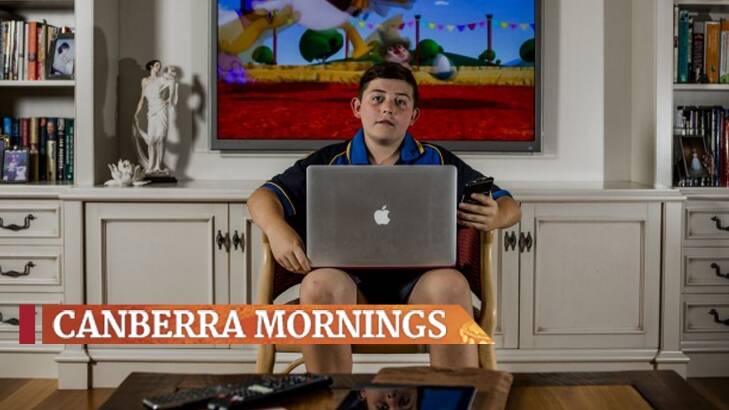 Like most Canberrans, Hamish Insley, 12, has a variety of devices he uses to access the internet.  Photo: Jamila Toderas