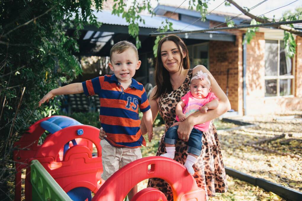 Nicole Tarling with her two children Colby, 3, and Olivia, 5 months, at home in Banks. Most population growth is happening in Canberra's north but Nicole is bucking the trend by raising her children in Tuggeranong.  Photo: Rohan Thomson