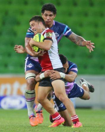 Jerome Niumata of the Vikings is wrapped up by the Rising defence. Photo: Getty Images