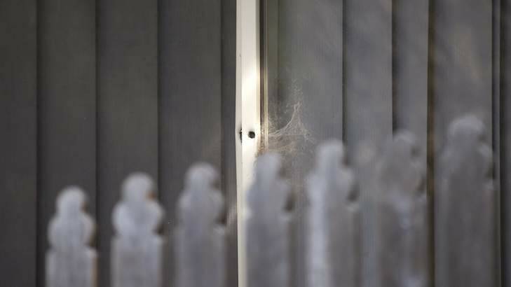 Bullet hole in the window frame of a home in Leita Court in Ngunnawal following a shooting on Saturday. Photo: Jeffrey Chan