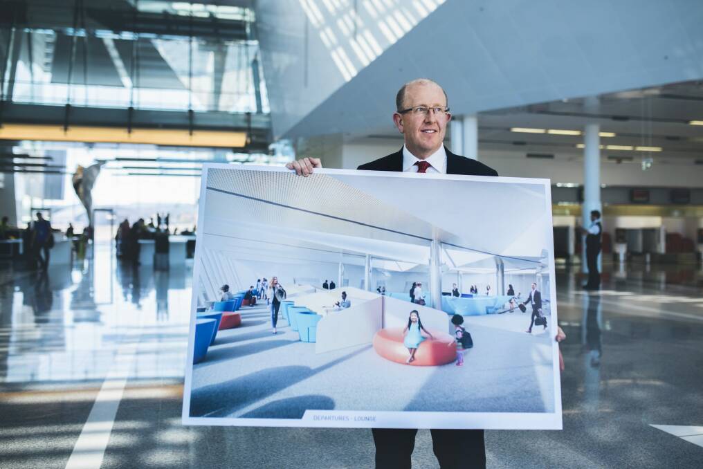 Canberra Airport general manager Stephen Byron with plans for the new international lounge. Photo: Rohan Thomson