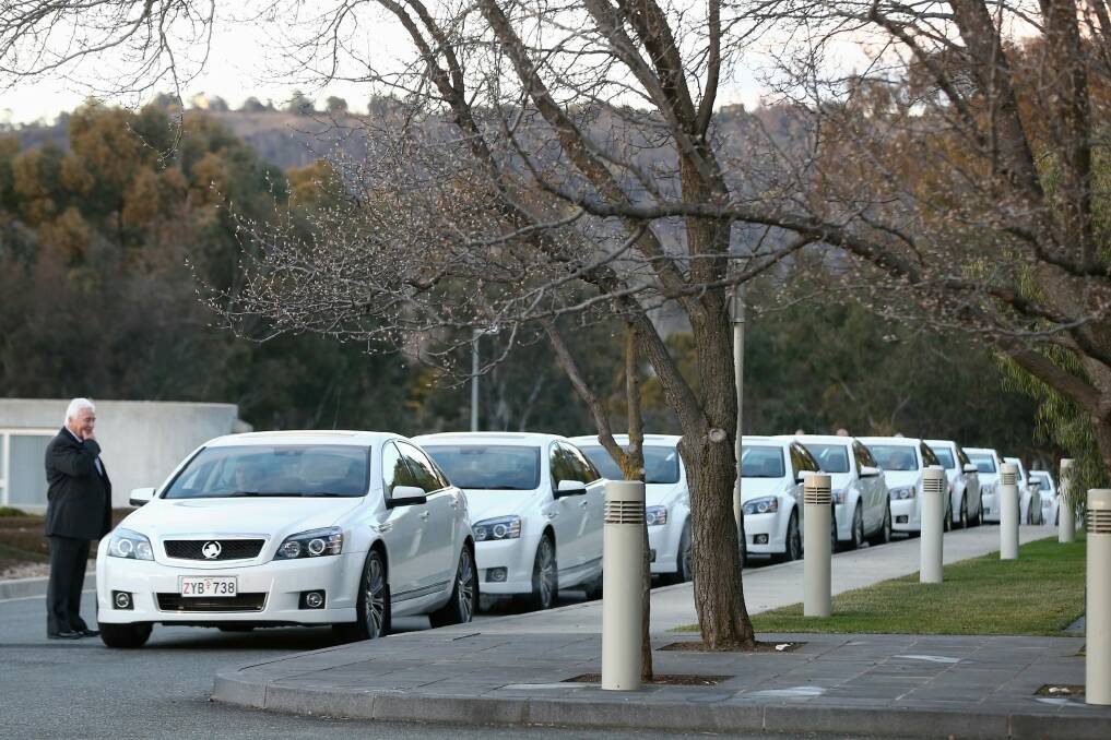 COMCARS line up outside the House of Representatives. Photo: Alex Ellinghausen