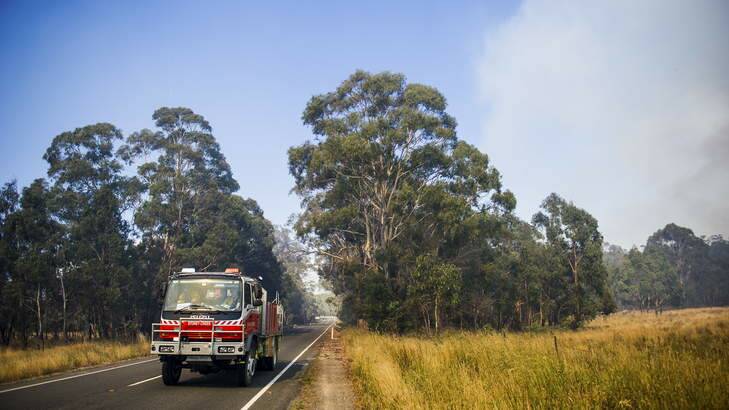 The scene from the Kings Highway. Crews work to contain fires near Bungendore. Photo: Rohan Thomson
