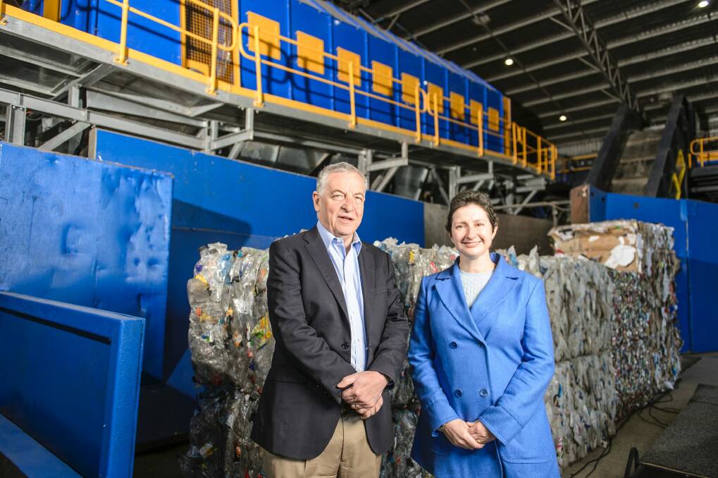 Chair of Re.Group Robert Hill and Transport Canberra and City Services (TCCS) DIrector-General Emmas Thomas in front of the imploder. Photo: Sitthixay Ditthavong