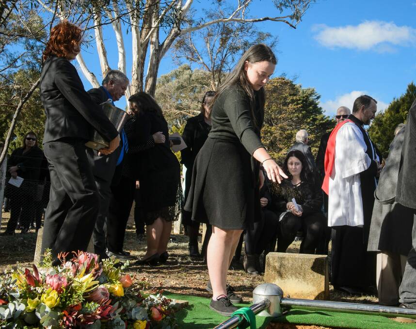 Charlotte Jeffery at the funeral of her grandfather Val Jeffery at the Queanbeyan Lawn Cemetery on Wednesday. Photo: Sitthixay Ditthavong