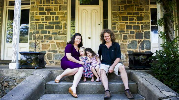 The Duncan family, Jamie, Rebecca, Matilda, 3, and Elsie, 1, outside their home in Yass. Photo: Rohan Thomson