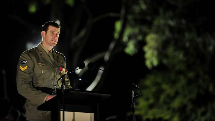 Corporal Ben Roberts-Smith VC MGl reads an emotive accounts of Australian service in Afghanistan at the Australian War Memorial Dawn Service. Photo: Jay Cronan