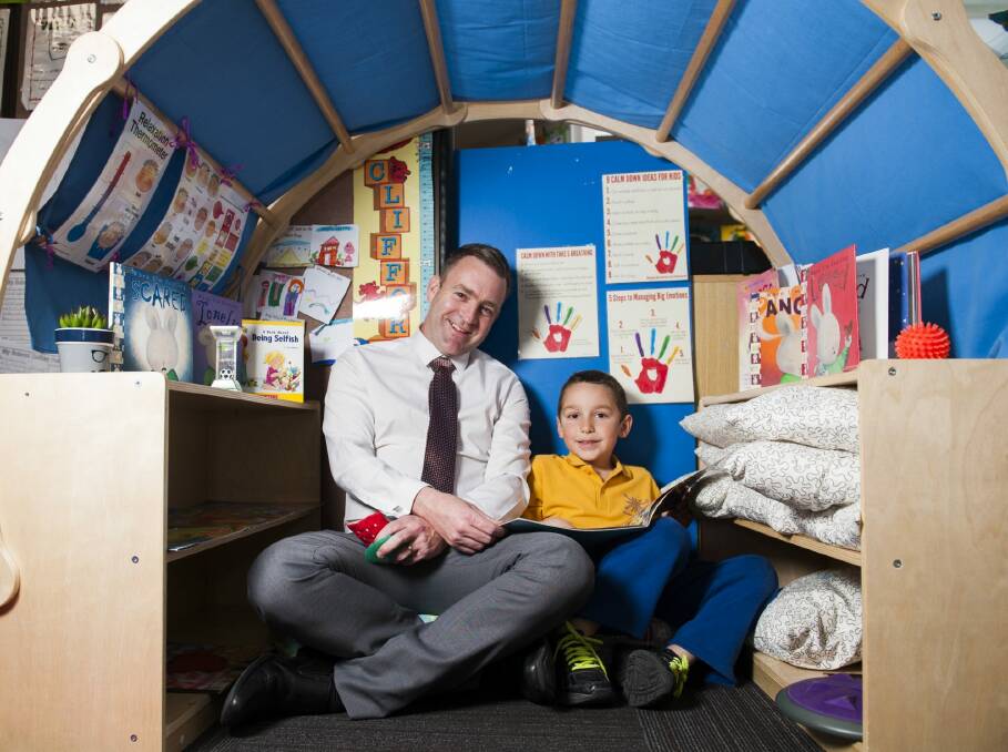 Theodore Primary School principal Matt Holdway with student Will Bourke in a sensory igloo. Photo: Elesa Kurtz