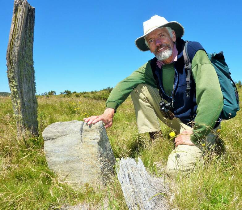 Matthew Higgins pays his respects at Francis Dunn's remote grave. Photo: Supplied
