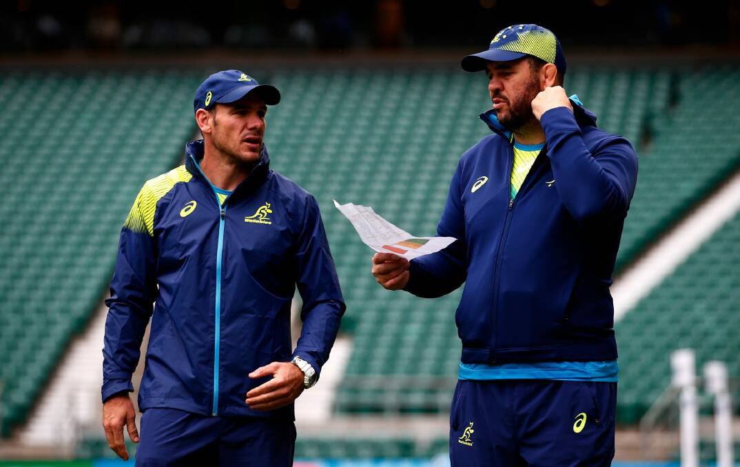 Spy claims: Michael Cheika with the piece of paper which revealed the Wallabies' tactics. Photo: Getty Images