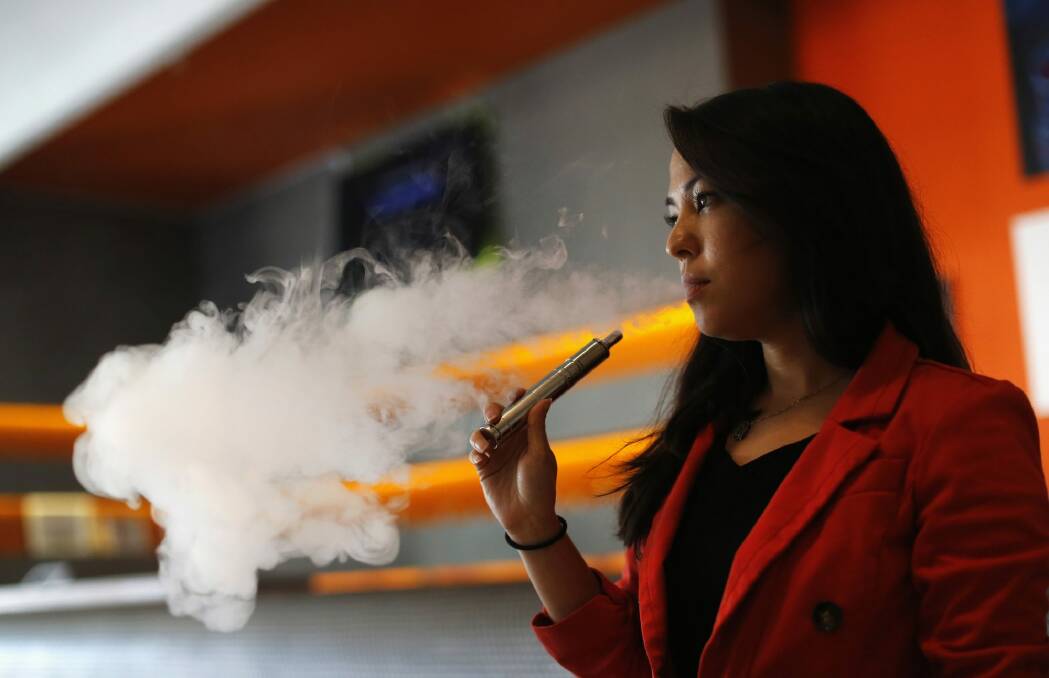 Regulate e-cigarettes: health groups. Photo: Reuters