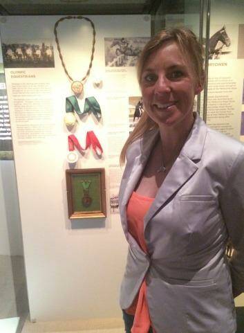 Talent: Equestrian Olympic silver medalist Megan Jones with her medal at the Spirited exhibition at the National Museum of Australia. Photo: Jil Hogan