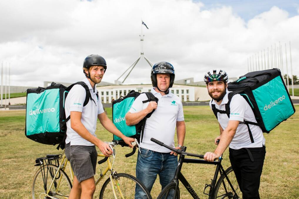 Deliveroo riders Hugh Bosman, Peter Baker, and Will Anderson. More than 50 riders have already signed up to deliver for the service, which is launching in Canberra. Photo: Jamila Toderas