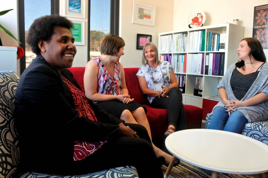 Femili PNG casework manager Evan Biseo with Lindy Kanan with Domestic Violence Crisis Service's director of crisis and legal Dearne Weaver and team leader Sarah Gillett.  Photo: Georgina Connery