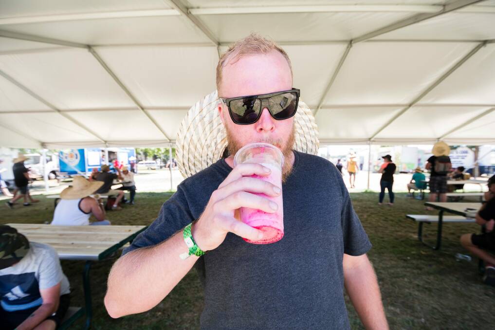 Scott Savage cools off with a slushie during the last day of Summernats. Photo: Dion Georgopoulos