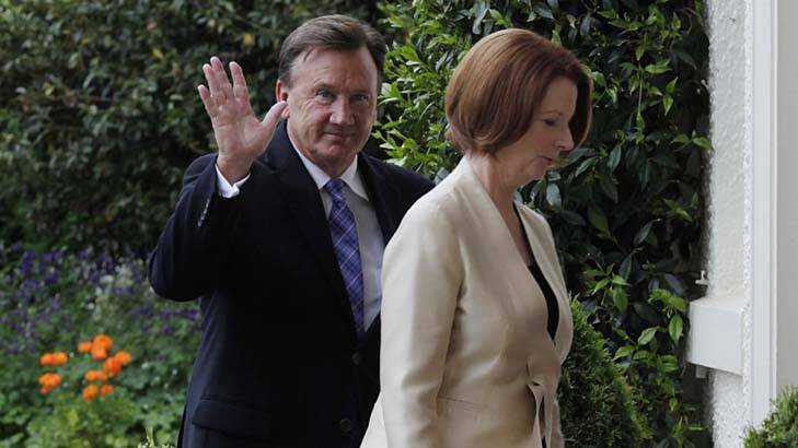 Prime Minister Julia Gillard and partner Tim Mathieson arrive for the ceremony at Government House. Photo: Andrew Meares