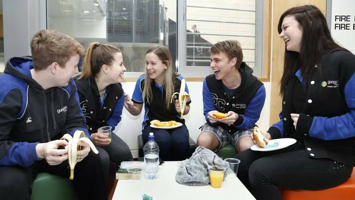 Gungahlin College Year 12 students Tarryn McClenahan-Brown, Peta Finglas- Watson, Brooke Commons, Louis Grant and Katherine Zeman chat while they eat their breakfast, before starting their ACT Scaling Test. Photo: Jeffrey Chan